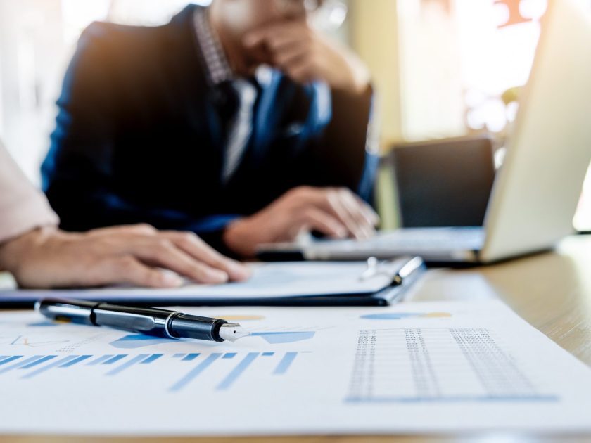 Team work process. young business managers crew working with new startup project. laptop on wood table, typing keyboard, texting message, analyse graph plans.